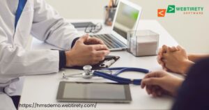 Doctor using a hospital management system on a tablet to improve patient care